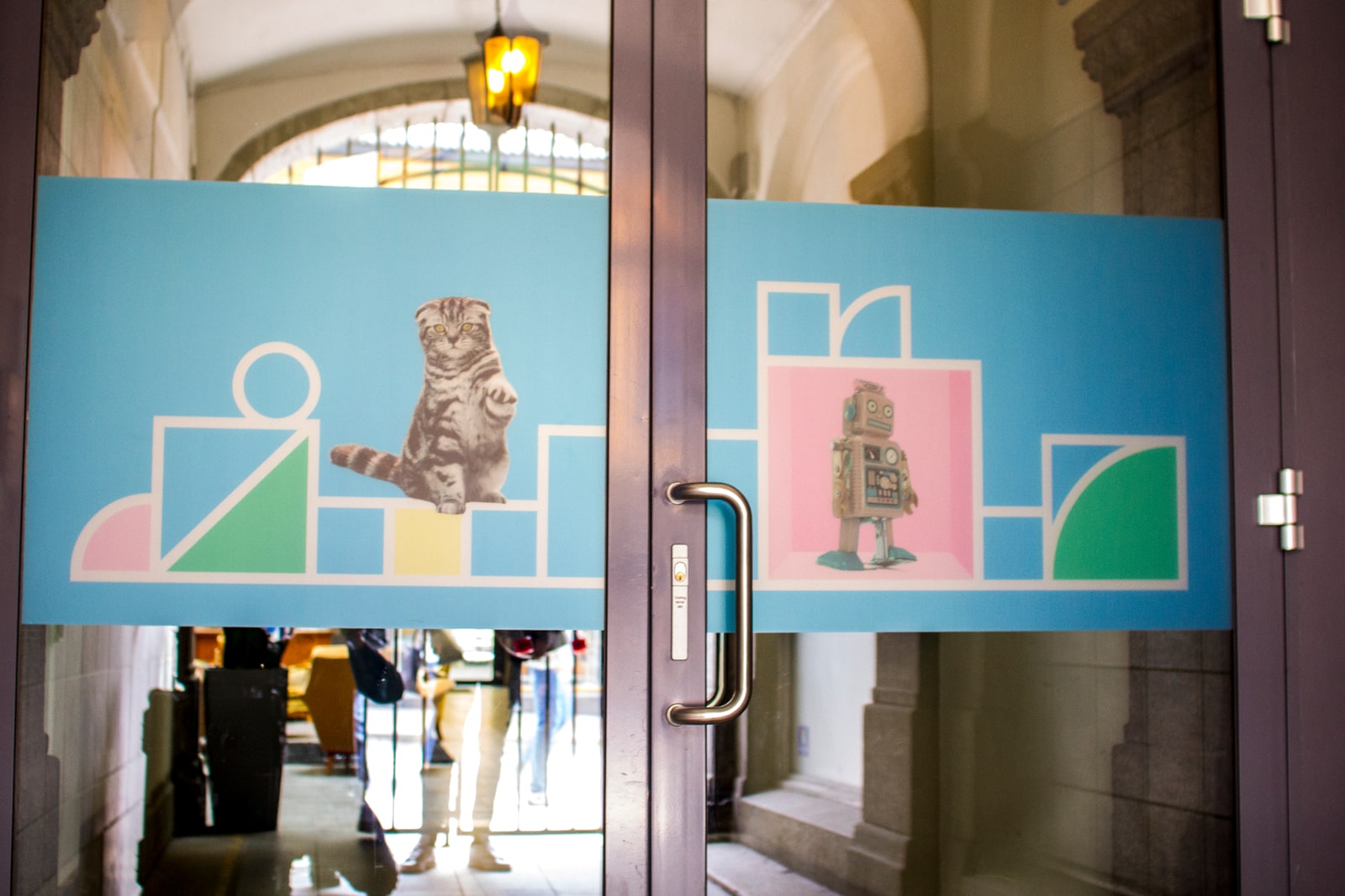 FINN glass doors decorated with geometric frames and animal photographs
