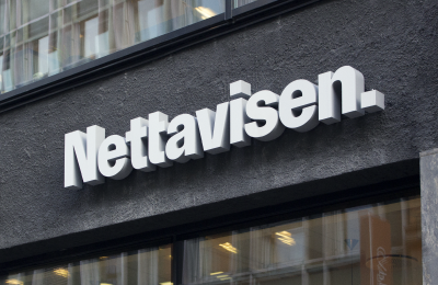 Nettavisen dimensional sign above the office entrance